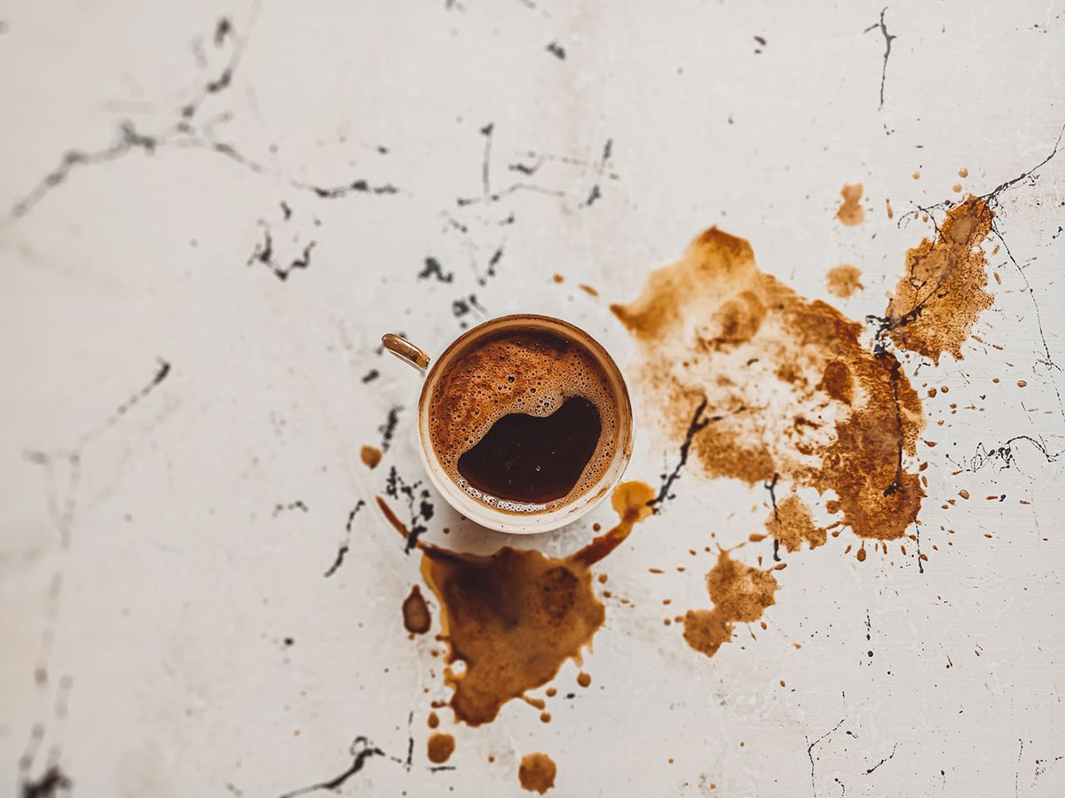 spilled coffee on marble counter top